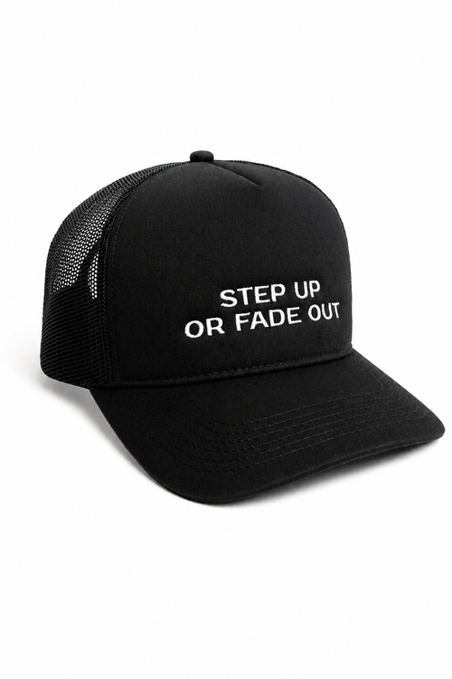 Angled front view of black trucker hat with white embroidered slogan reading "STEP UP OR FADE OUT"