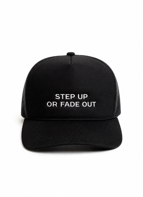 Black trucker hat with white embroidered slogan reading "STEP UP OR FADE OUT" on the front, shown against a plain white background