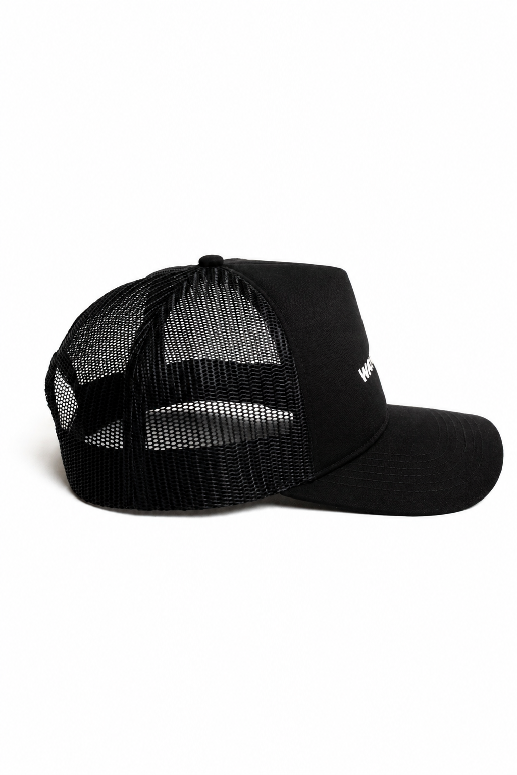 Side profile of black trucker hat showing breathable mesh