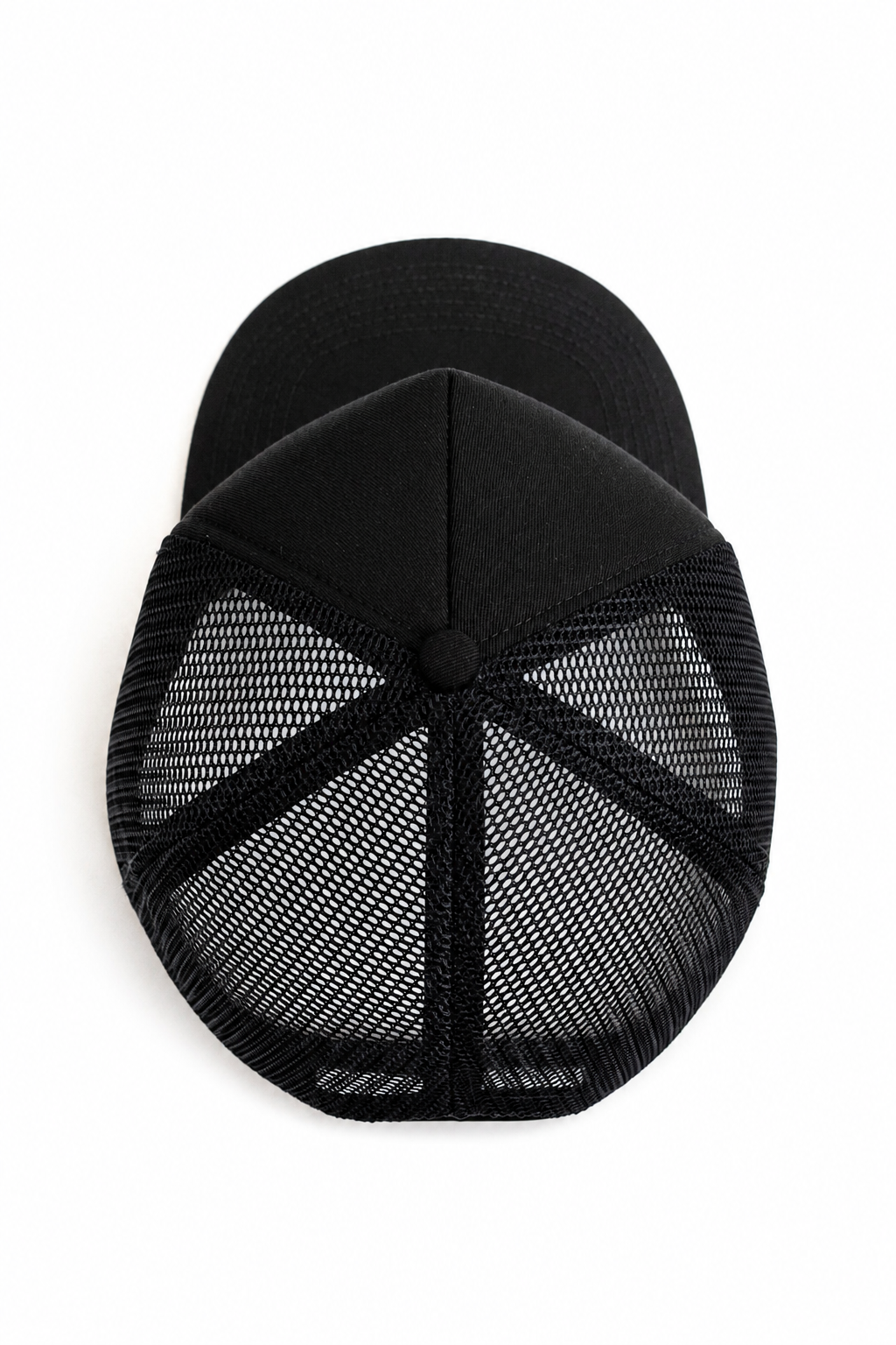 Black trucker hat with a solid black curved brim and black mesh back panels, shown from a top-down view on a white background