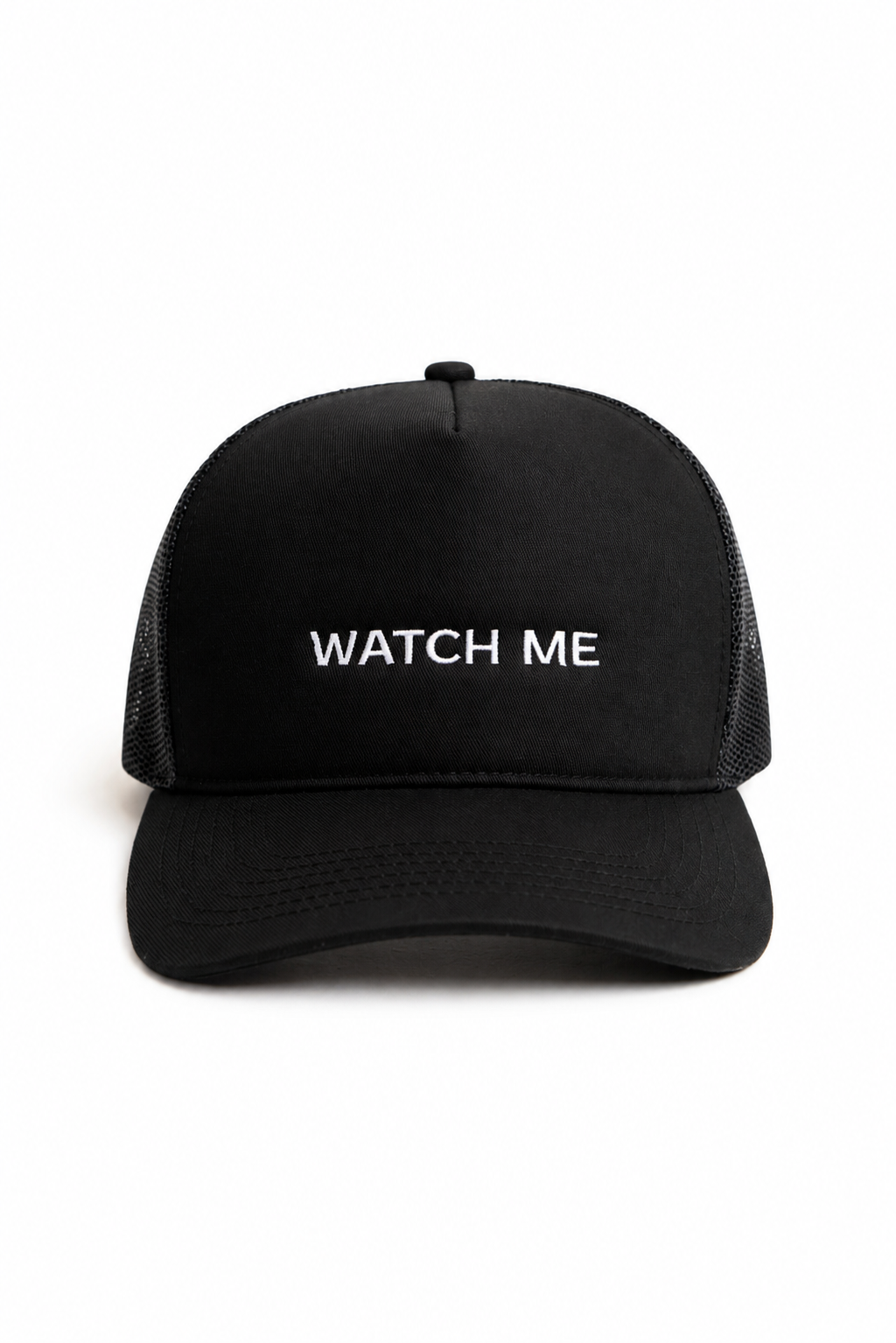 Black trucker hat with white embroidered slogan reading "WATCH ME" on the front, shown against a plain white background
